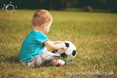 Boy playing football on #Daysoutwithkids