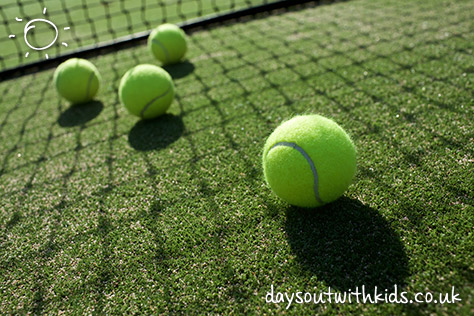 bigstock-Tennis-Balls-On-Tennis-Grass-C-93961142