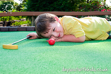 bigstock-Young-boy-plays-mini-golf-on-p-20023571