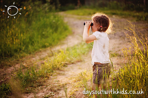 bigstock-child-girl-watching-birds-with-104215709