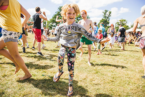 boy dancing in field