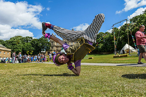 entertainer balancing on elbow