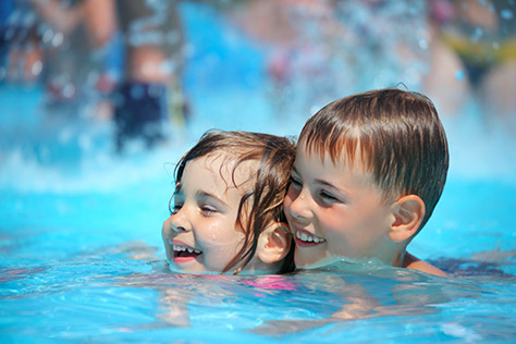 bigstock-Smiling-Boy-And-Little-Girl-Sw-7007282