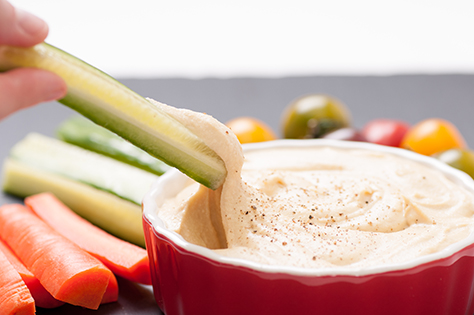 ground chickpea hummus with flatbreads and vegetables for dipping