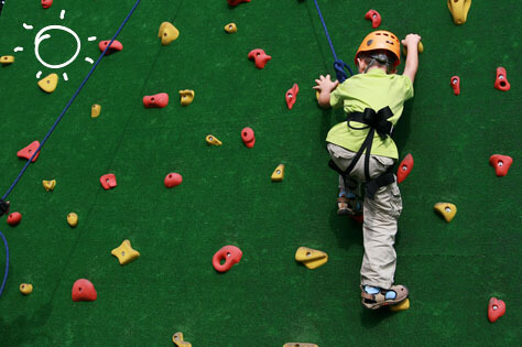 bigstock-child-climbing-on-a-wall-in-an-resize