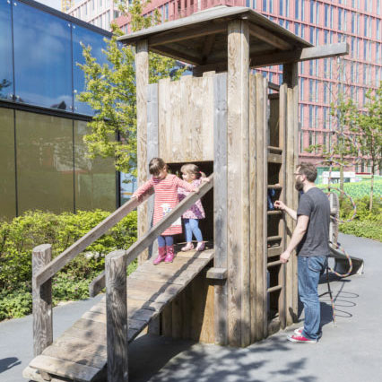 Handyside Gardens - two children on a wooden play structure.